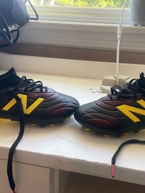 New Balance Kids Black & Yellow Soccer Cleats with Red Accents